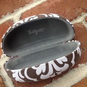Thirty one brown and white print glasses case